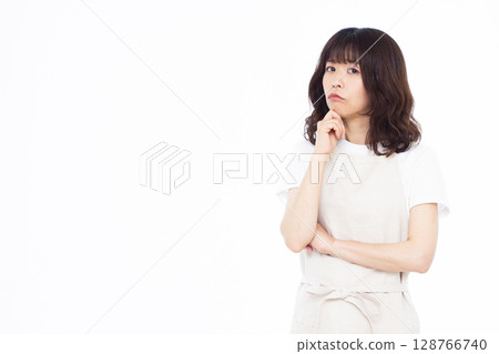 A housewife who is seriously worried 128766740