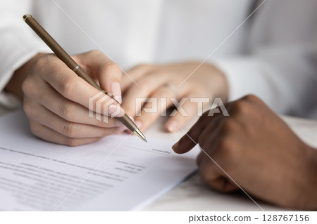 Client signing contract, authorizing service agreement, close up 128767156