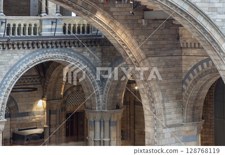 the striking arches and grand structures, is characteristic of the Romanesque Revival style with contemporary Victorian materials and design within Hintze Hall. the striking arches and grand structures, is characteristic of the Romanesque Revival style with contemporary Victorian materials and design within Hintze Hall. 128768119