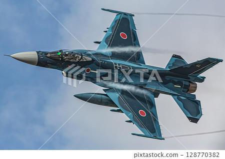 fighter plane flying in the sky 128770382