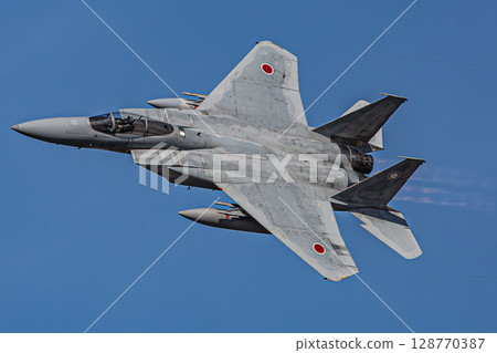 fighter jet flying in the blue sky 128770387