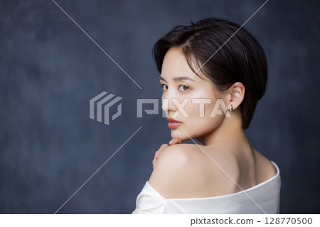 A woman with short hair A woman with short hair 128770500