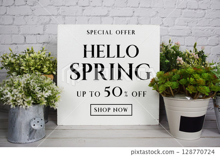 Hello Spring Sale 50% off Promotion Offer Discount Retail Shopping Concept Hello Spring Sale 50% off Promotion Offer Discount Retail Shopping Concept 128770724