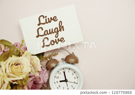 Live Laugh Love Card with colorful flowers border frame on pink background Live Laugh Love Card with colorful flowers border frame on pink background 128770868