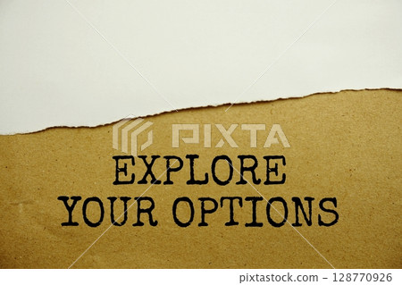 Explore Your Options message written on craft paper with torn paper background 128770926