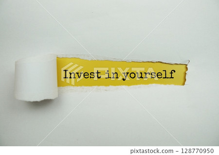 Invest In Yourself message written on yellow paper with torn paper background 128770950