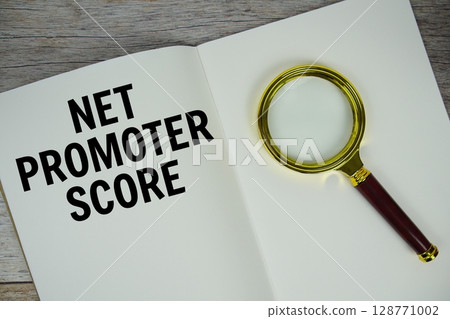 Net Promoter Score text message written on paper note with magnifying glass top view on wooden background Net Promoter Score text message written on paper note with magnifying glass top view on wooden background 128771002