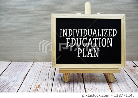 Individualized Education Plan text written on chalkboard with easel on wooden background Individualized Education Plan text written on chalkboard with easel on wooden background 128771143