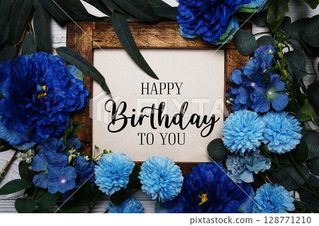 Happy Birthday to you text with flowers bouquet decoration on wooden background Happy Birthday to you text with flowers bouquet decoration on wooden background 128771210