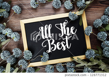 All The Best Motivational and Inspirational quotes text on blackboard with flowers decoration on wooden background 128771312