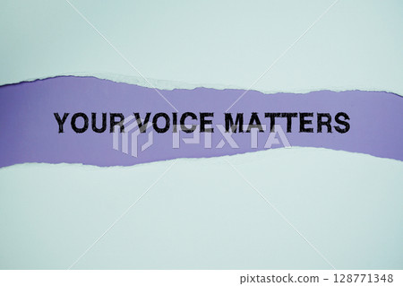 Your Voice Matters text on purple with white paper ripped of horizontal paper torn 128771348
