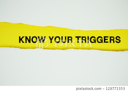 Know Your Triggers text on yellow with white paper torn ripped of horizontal 128771353
