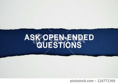 Ask Open-Ended Questions text on navy blue with white paper torn ripped of horizontal 128771369
