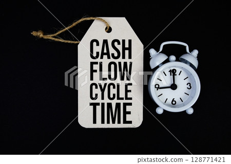 Cash Flow Cycle Time text on price tag with alarm clock on black background 128771421