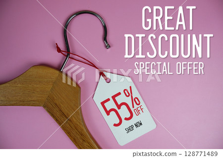 Great Discount Sale 55% off price tag label with Clothes hanger Clothing Promotion shopping concept Great Discount Sale 55% off price tag label with Clothes hanger Clothing Promotion shopping concept 128771489