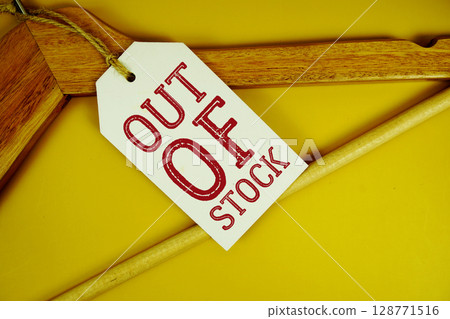 Out Of Stock text on price tag label with Clothes hanger Clothing Promotion shopping concept Out Of Stock text on price tag label with Clothes hanger Clothing Promotion shopping concept 128771516