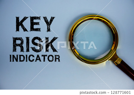 Key Risk Indicator text with magnifying glass on blue background 128771601