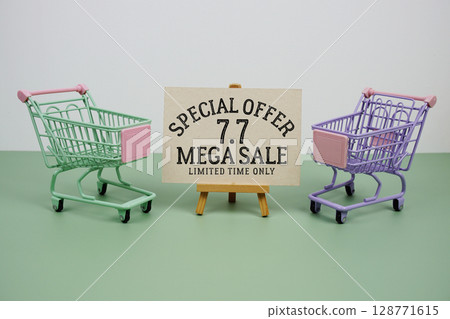 7.7 Mega Sale Special Offer text with mini trolley shopping cart on green background 7.7 Mega Sale Special Offer text with mini trolley shopping cart on green background 128771615