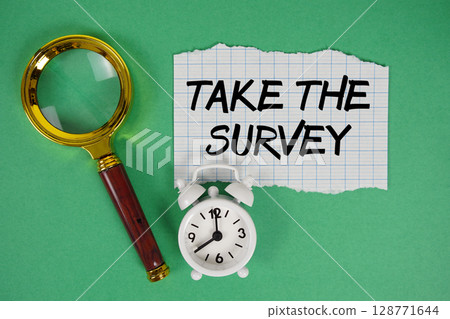 Take The Survey text written on paper with magnifying glass and alarm clock Take The Survey text written on paper with magnifying glass and alarm clock 128771644