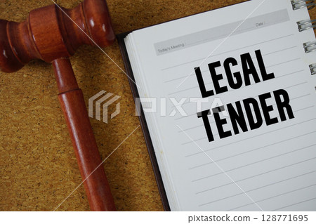 Legal Tender text written on notebook paper with Judges Gavel Legal Tender text written on notebook paper with Judges Gavel 128771695