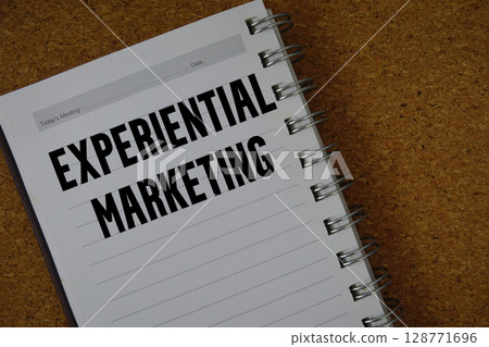 Experiential Marketing text written on notebook paper Experiential Marketing text written on notebook paper 128771696