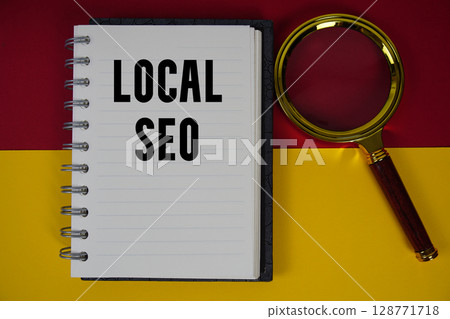 Local SEO text written on notebook paper with magnifying glass Local SEO text written on notebook paper with magnifying glass 128771718