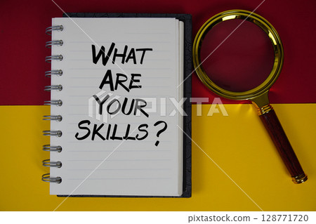 What Are Your Skills? text written on notebook paper with magnifying glass What Are Your Skills? text written on notebook paper with magnifying glass 128771720