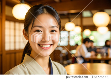 Woman working in a restaurant 128773368