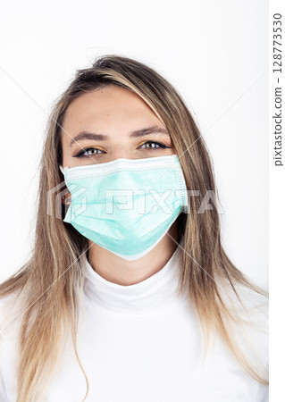 Woman portrait with black medicine face mask Woman portrait with black medicine face mask 128773530