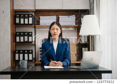 Business woman using tablet and laptop for doing math finance on an office desk, tax, report, accounting, statistics, and analytical research concept Business woman using tablet and laptop for doing math finance on an office desk, tax, report, accounting, statistics, and analytical research concept 128773812