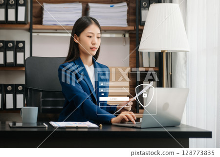 Cyber security concept, Login, User, identification information security and encryption, secure access to user's personal information woman using smart phone and tablet in office 128773835