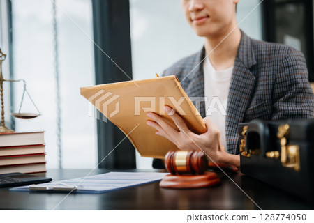 justice advice and law judge legislation concept. tribunal Attorney lawyer working with documents and white gavel on tabel justice advice and law judge legislation concept. tribunal Attorney lawyer working with documents and white gavel on tabel 128774050