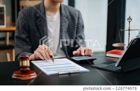 justice advice and law judge legislation concept. tribunal Attorney lawyer working with documents and white gavel on tabel justice advice and law judge legislation concept. tribunal Attorney lawyer working with documents and white gavel on tabel 128774078