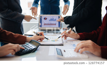 Business People Planning Strategy Analysis Office Concept. writing notes about sticky notes Laptop,tablet  Planning and Brainstorming Strategies in office 128774157