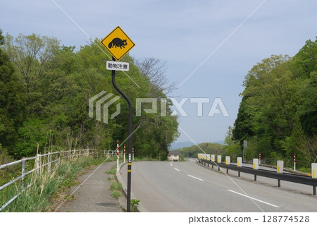 Road sign: Animals may jump out Road sign: Animals may jump out 128774528