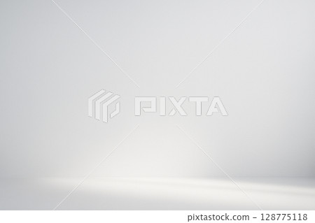 Background of natural light reflecting off the floor and illuminating the white wall 128775118