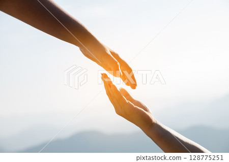 Young woman hand reaching for mountains. Spiritual girl smiling to sky. Happy female being thankful. Spiritual girl praying with hope. Positive asian young woman feeling hope and faith looking up. 128775251