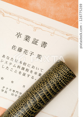 Close-up of diploma and tube 128775289