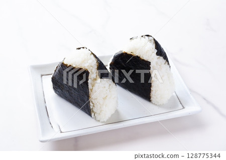 Onigiri - Delicious rice balls made with freshly cooked rice Onigiri - Delicious rice balls made with freshly cooked rice 128775344
