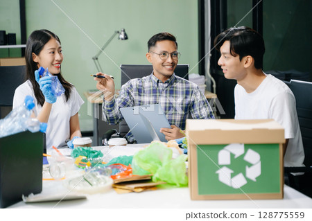 Eco-friendly teamwork with this office recycling scene. Perfect for showcasing sustainability, collaboration, and environmental consciousness 128775559