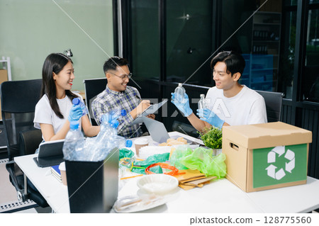 Eco-friendly teamwork with this office recycling scene. Perfect for showcasing sustainability, collaboration, and environmental consciousness 128775560