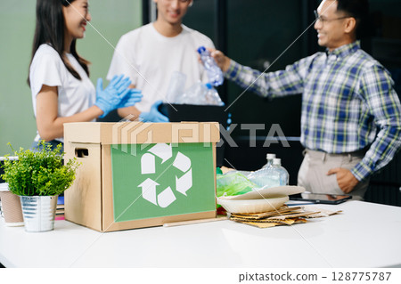Eco-friendly teamwork with this office recycling scene. Perfect for showcasing sustainability, collaboration, and environmental consciousness 128775787