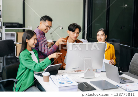 Business team discuss at meeting room. working together with laptop ,tablet and smart phone on desk Financial 128775811