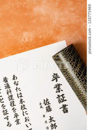 Close-up of diploma and tube Close-up of diploma and tube 128775969