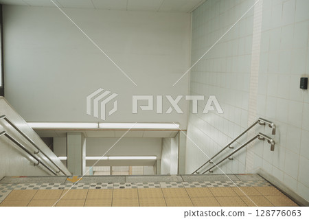Barrier-free double handrail staircase (inside Saginuma Station, Kawasaki City) 128776063