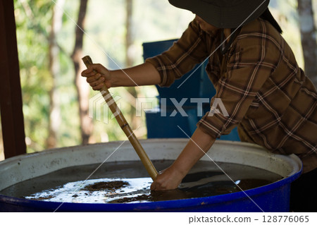 Close up smart farmer techniques hand coffee bean machinery roast apparatus dry sunlight tool sunbeam sunray sunshine fresh garden produce agriculture promotes farmer concept farm blur background 128776065