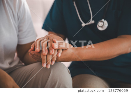 Hand and deep empathy, doctor offers medicine, support and hope to every patient, building trust through compassionate health care in clinic, hospital setting true care and medicals restore health. Hand and deep empathy, doctor offers medicine, support and hope to every patient, building trust through compassionate health care in clinic, hospital setting true care and medicals restore health. 128776069
