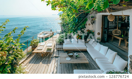 A tranquil coastal terrace adorned with greenery offers stunning ocean views, perfect for relaxation and serene moments. 128776724