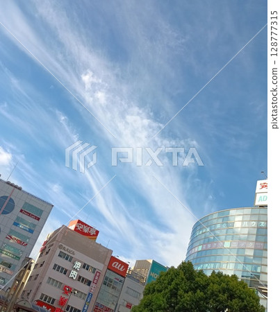 Mysterious clouds soaring through the summer sky like dragons Mysterious clouds soaring through the summer sky like dragons 128777315
