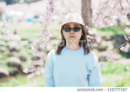 Woman tourist sightseeing Kitakami Tenshochi Park with Sakura Cherry Blossom in Spring, traveler travel in Kitakami festival, Iwate prefecture, Japan. Landmark for Travel and Vacation destination 128777387